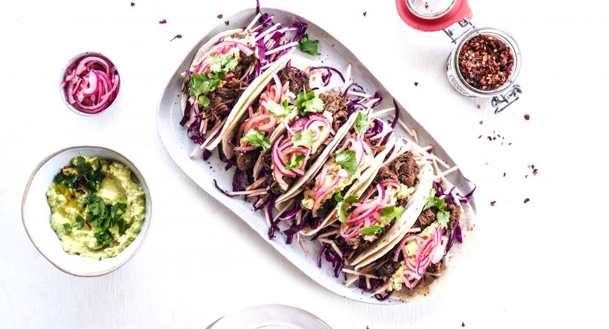 Slow Cooked Chipotle Beef Tacos with Slaw, Guacamole & Pickled Onion